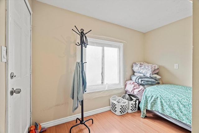 bedroom with hardwood / wood-style flooring