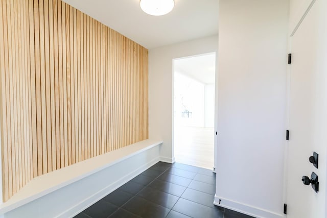 mudroom featuring dark tile patterned floors