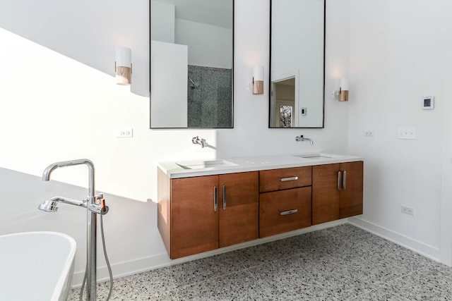 bathroom featuring vanity and a tub to relax in