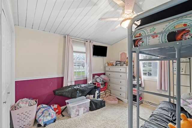 bedroom with ceiling fan, carpet floors, and wood ceiling