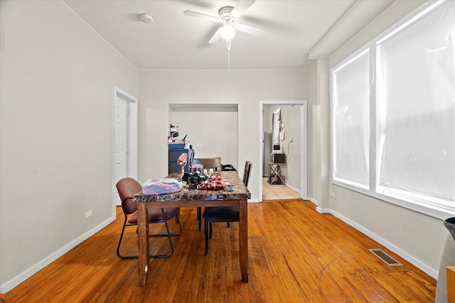 dining area featuring ceiling fan and hardwood / wood-style floors