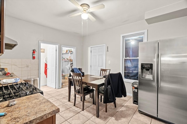 dining area with ceiling fan and light tile patterned floors