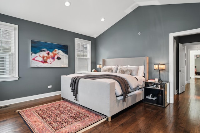 bedroom featuring dark hardwood / wood-style flooring and high vaulted ceiling