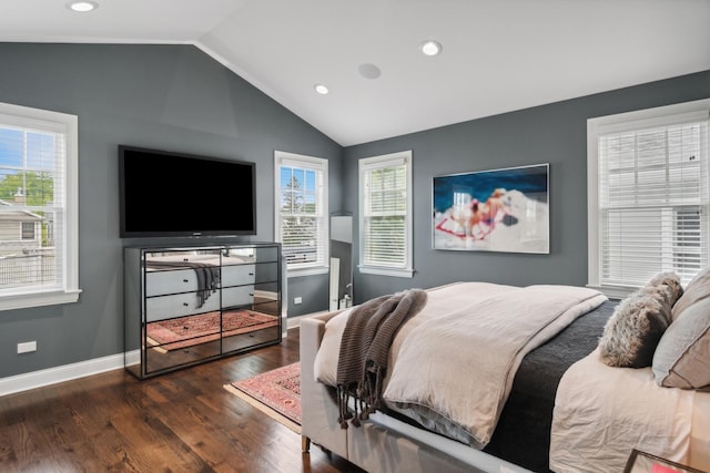 bedroom with dark hardwood / wood-style flooring, lofted ceiling, and multiple windows