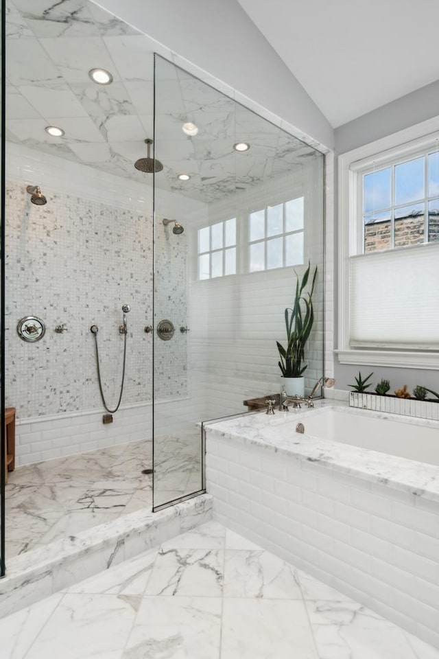 bathroom with shower with separate bathtub