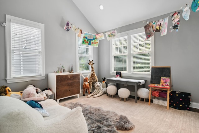 rec room featuring plenty of natural light, carpet, and lofted ceiling