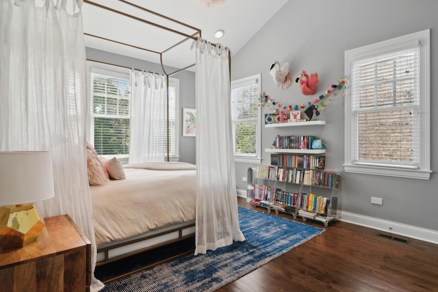 bedroom featuring dark hardwood / wood-style floors and vaulted ceiling