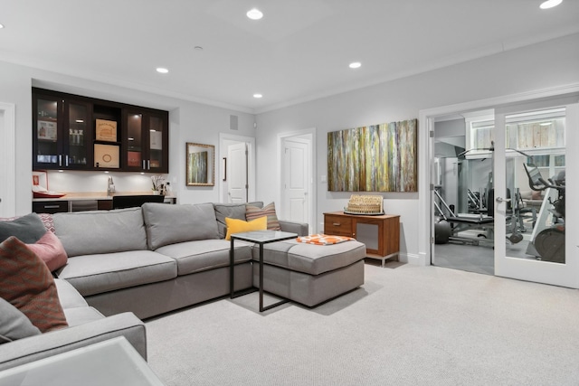 carpeted living room featuring indoor bar