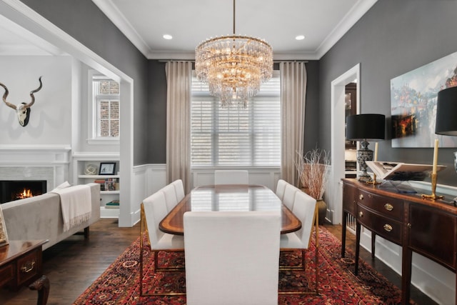 dining area with a notable chandelier, dark hardwood / wood-style floors, and crown molding