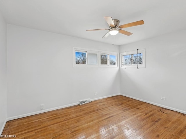 spare room with ceiling fan and light hardwood / wood-style floors