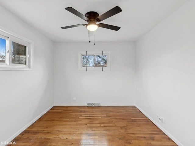 unfurnished dining area with ceiling fan, a healthy amount of sunlight, and light hardwood / wood-style floors