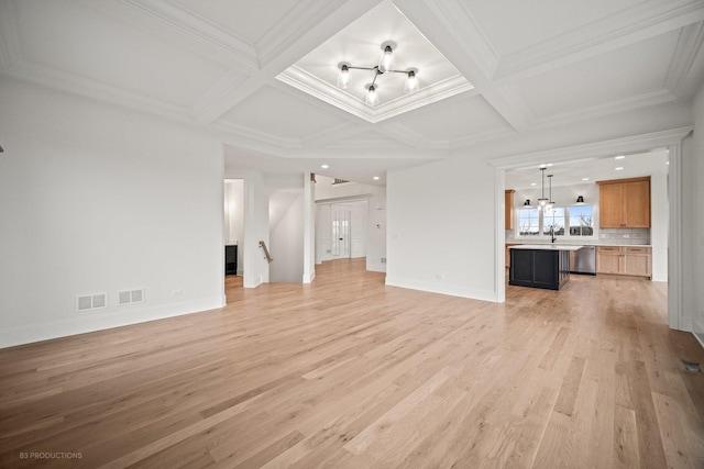 unfurnished living room featuring beamed ceiling, light hardwood / wood-style flooring, coffered ceiling, and crown molding