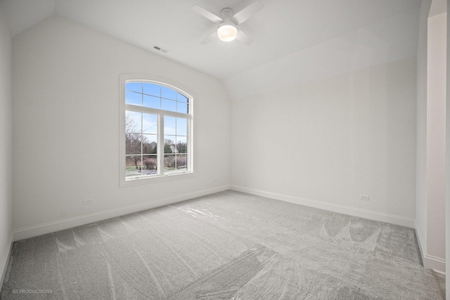 unfurnished room with light colored carpet, ceiling fan, and lofted ceiling