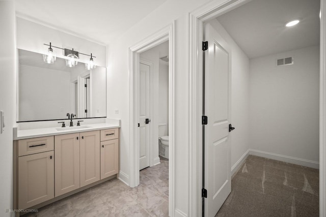 bathroom with vanity and toilet