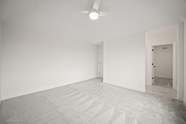 carpeted spare room with ceiling fan