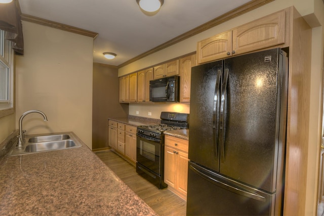 kitchen with crown molding, sink, black appliances, light brown cabinets, and light hardwood / wood-style floors