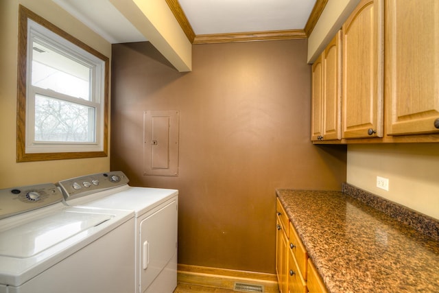 washroom featuring cabinets, electric panel, washer and clothes dryer, and crown molding