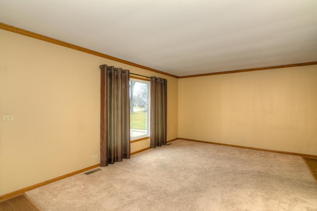 spare room with light colored carpet and ornamental molding