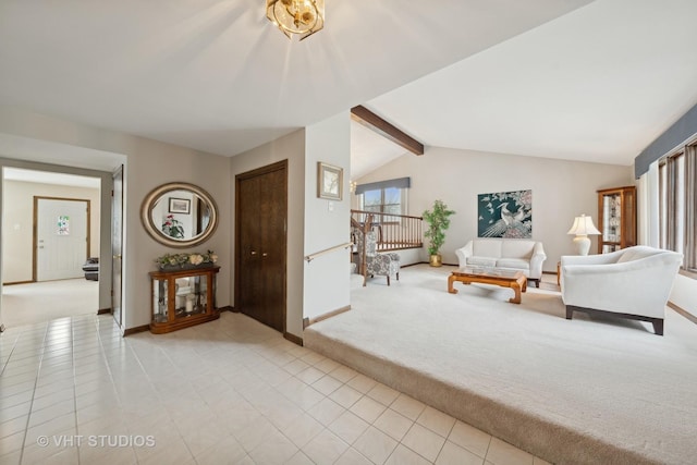 carpeted living room featuring lofted ceiling with beams