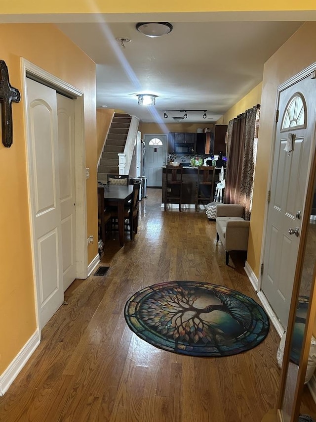 hallway with dark wood-type flooring