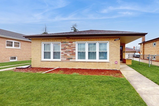 view of side of property with a lawn