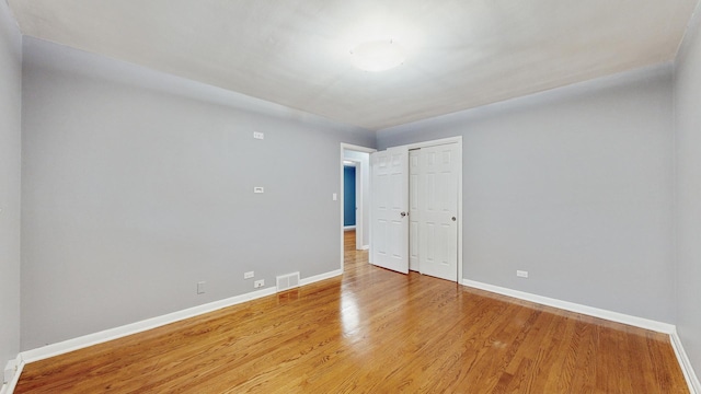 unfurnished room featuring light hardwood / wood-style floors