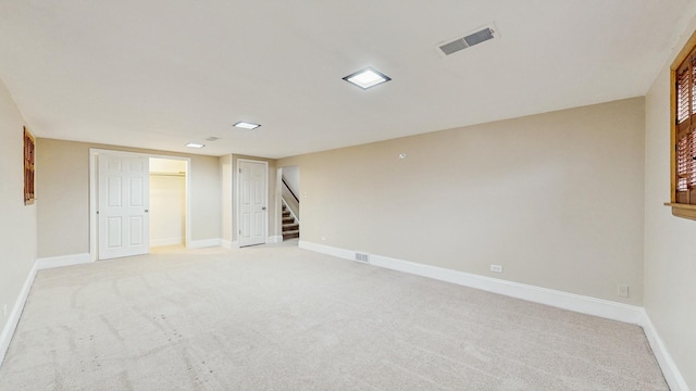 basement with light colored carpet