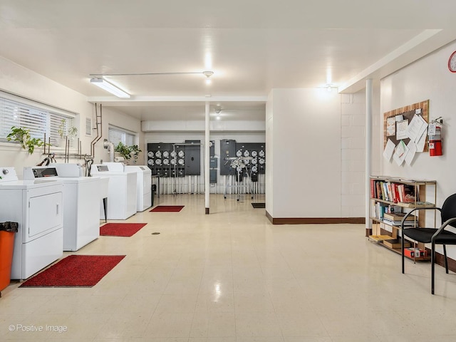 clothes washing area with separate washer and dryer