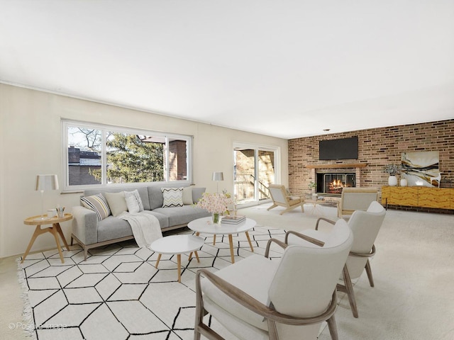 living room featuring a brick fireplace and brick wall