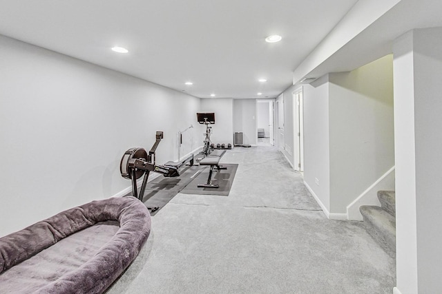 exercise room with light colored carpet