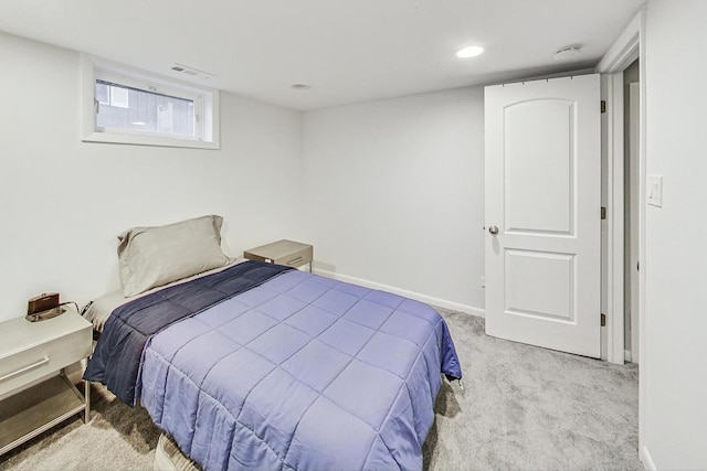 bedroom with light colored carpet