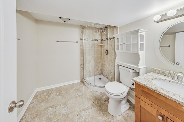 bathroom with vanity, toilet, and a shower with door