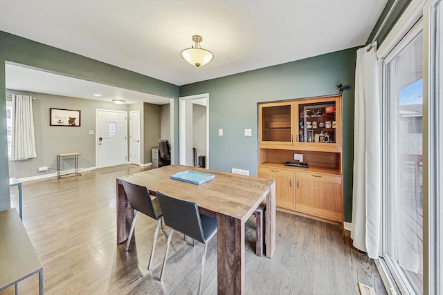 dining space featuring hardwood / wood-style flooring