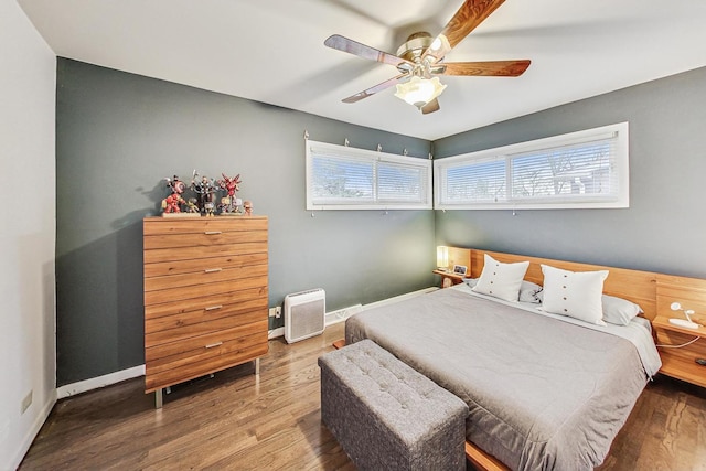 bedroom featuring hardwood / wood-style floors and ceiling fan