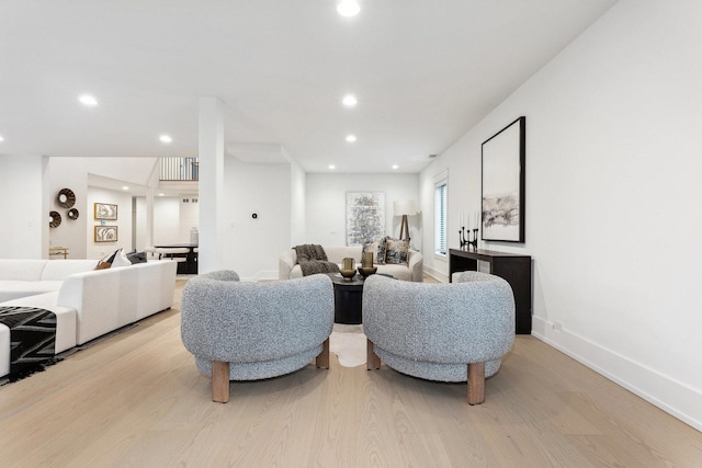 living room with light hardwood / wood-style flooring