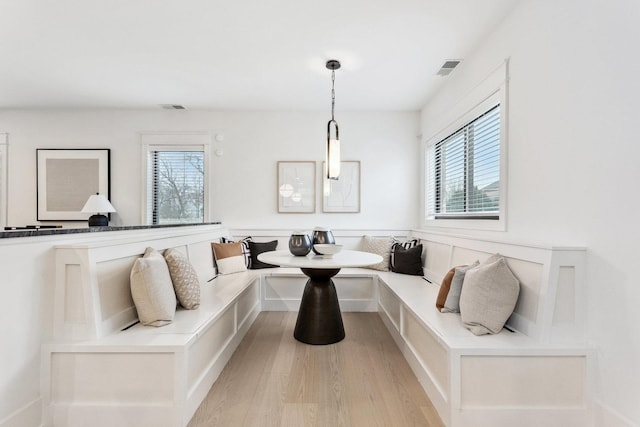 dining area with breakfast area and light wood-type flooring