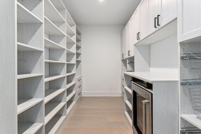 pantry featuring wine cooler