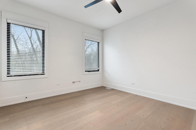 unfurnished room featuring ceiling fan and light wood-type flooring