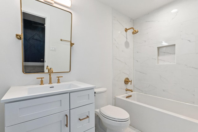 full bathroom featuring vanity, toilet, and tiled shower / bath