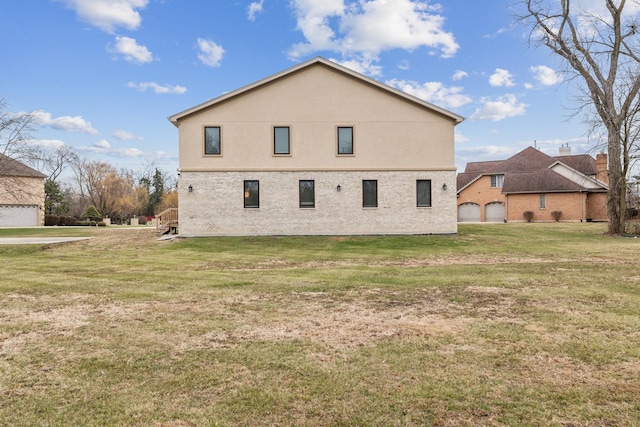 view of side of home featuring a lawn and a garage