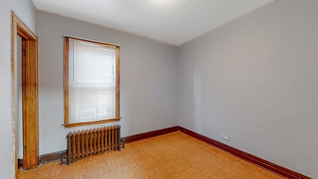 7549 W 62nd St, Summit, IL 60501 - spare room with baseboards and radiator heating unit