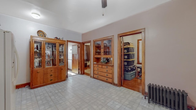 7549 W 62nd St, Summit, IL 60501 - interior space featuring radiator and light floors