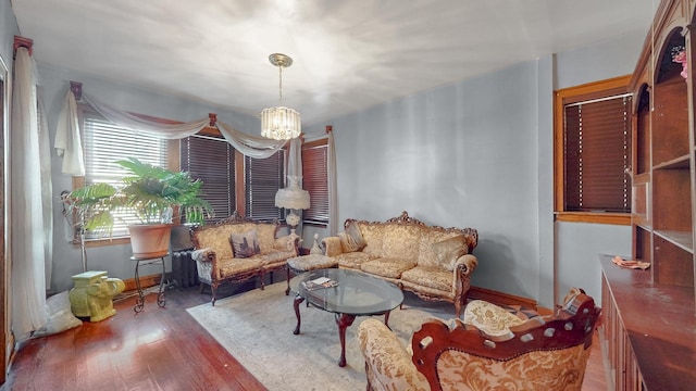 7549 W 62nd St, Summit, IL 60501 - living area with a notable chandelier, baseboards, and wood finished floors