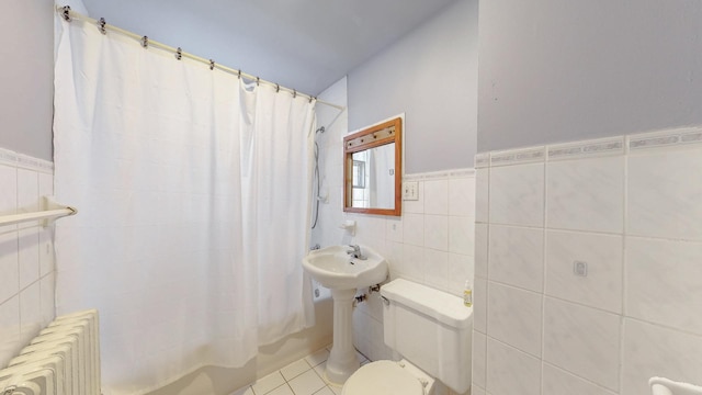 7549 W 62nd St, Summit, IL 60501 - full bath featuring tile patterned flooring, toilet, shower / tub combo with curtain, radiator heating unit, and tile walls