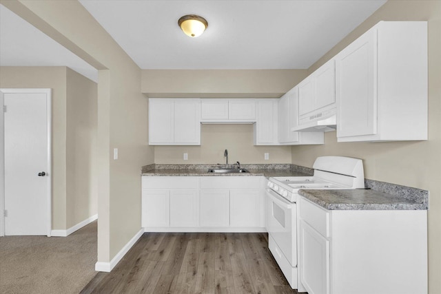 kitchen with white stove, ventilation hood, white cabinetry, and sink