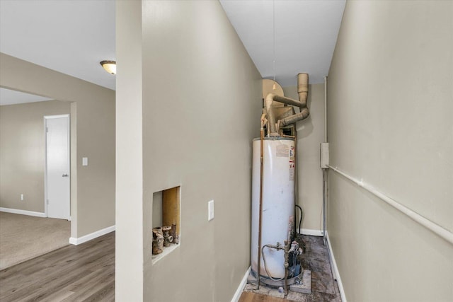 utility room featuring water heater