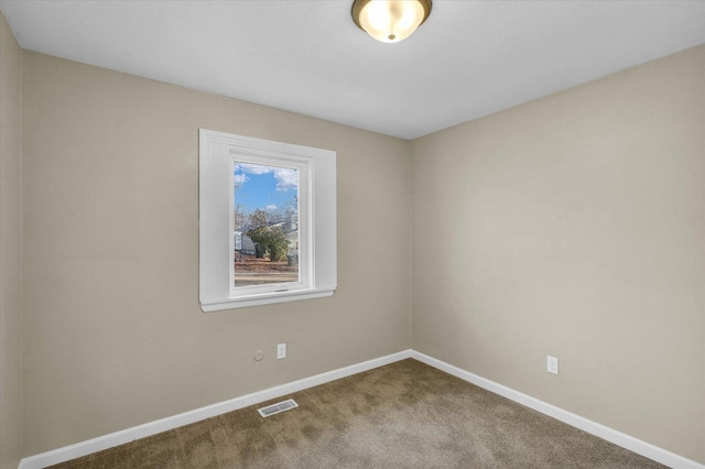 spare room featuring carpet flooring