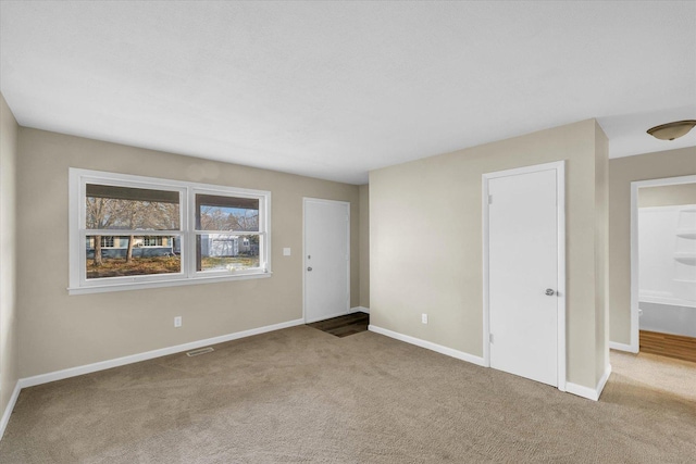 unfurnished room featuring carpet floors