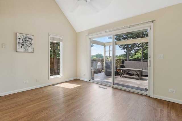 unfurnished room with high vaulted ceiling, ceiling fan, and wood-type flooring