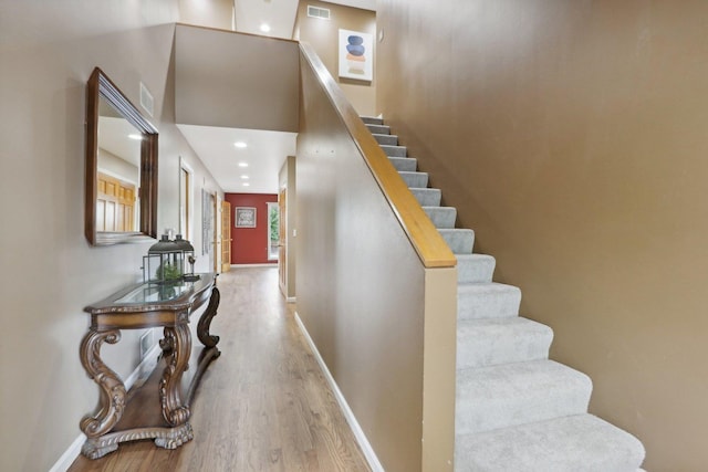 staircase featuring hardwood / wood-style flooring